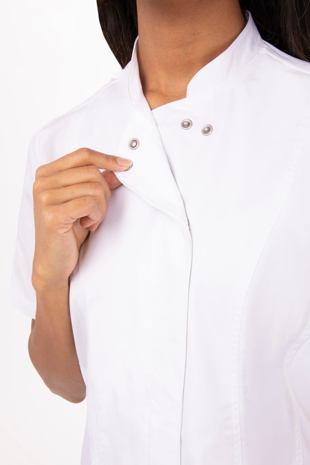 A women's chef jacket in white, featuring a stand-up collar and snap button closure, with branding visible.