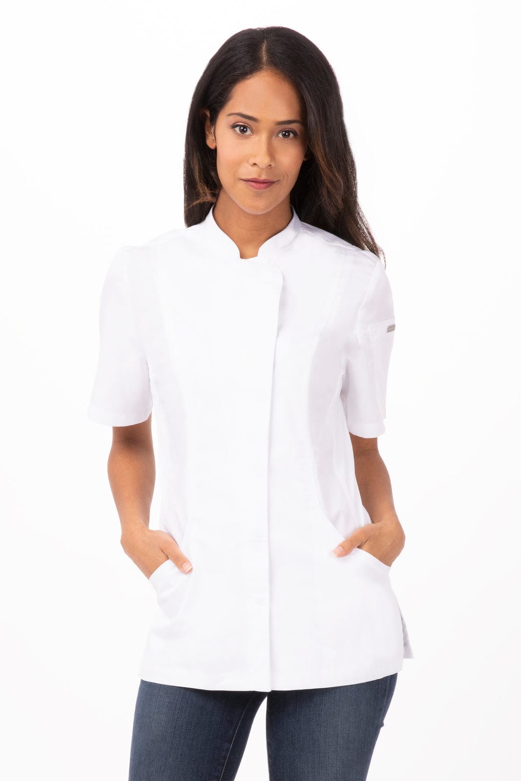 A women's white chef jacket with a short collar and pockets, displayed on a model. It features a logo.
