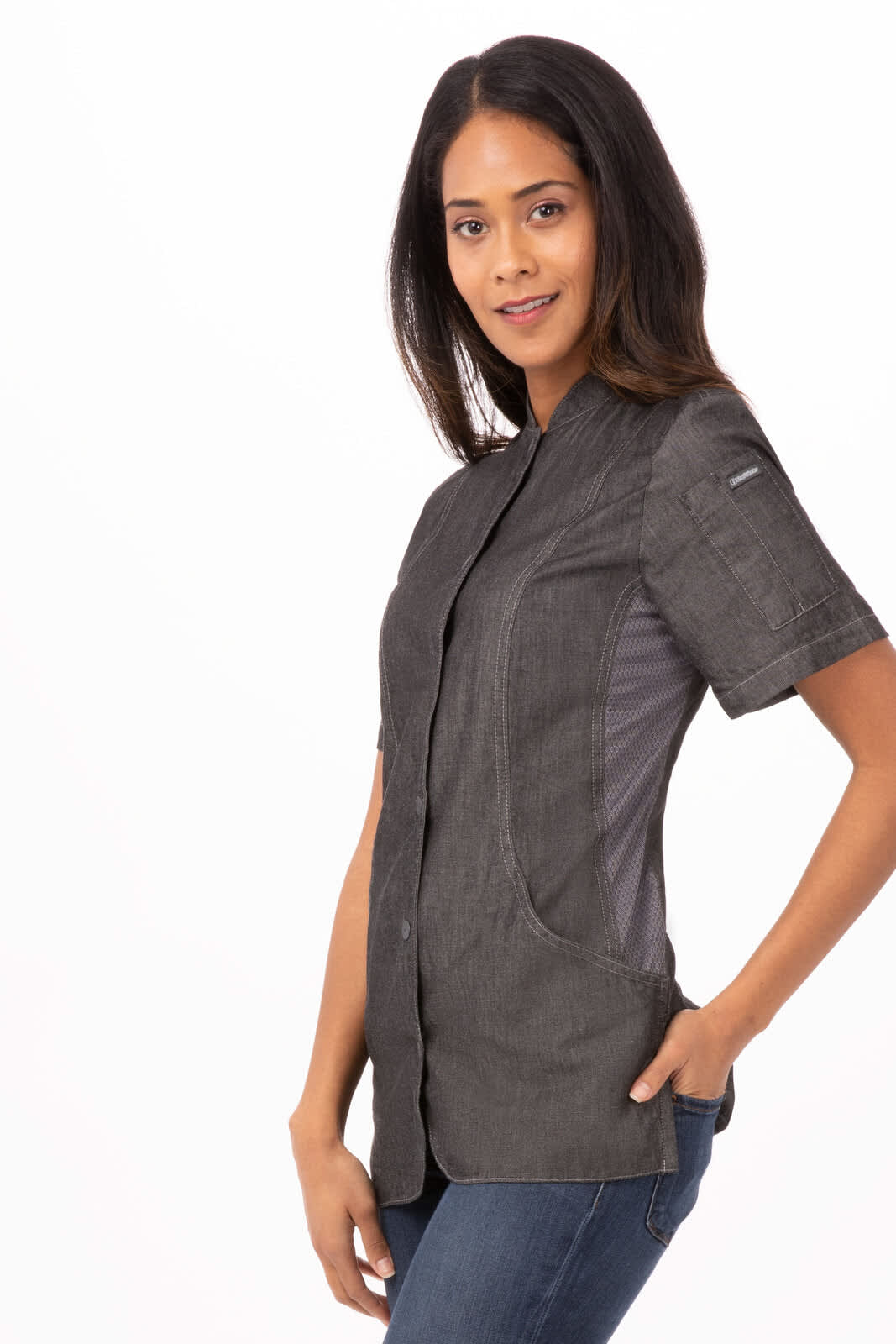 A chef jacket in dark grey with short sleeves, featuring a fitted design and side pockets, displayed on a model.