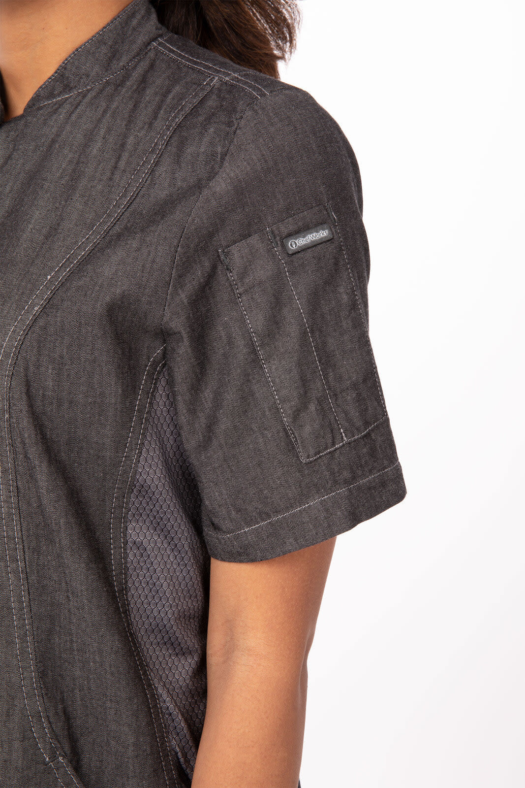 A dark grey chef jacket featuring short sleeves and a textured design, with an arm pocket and logo.