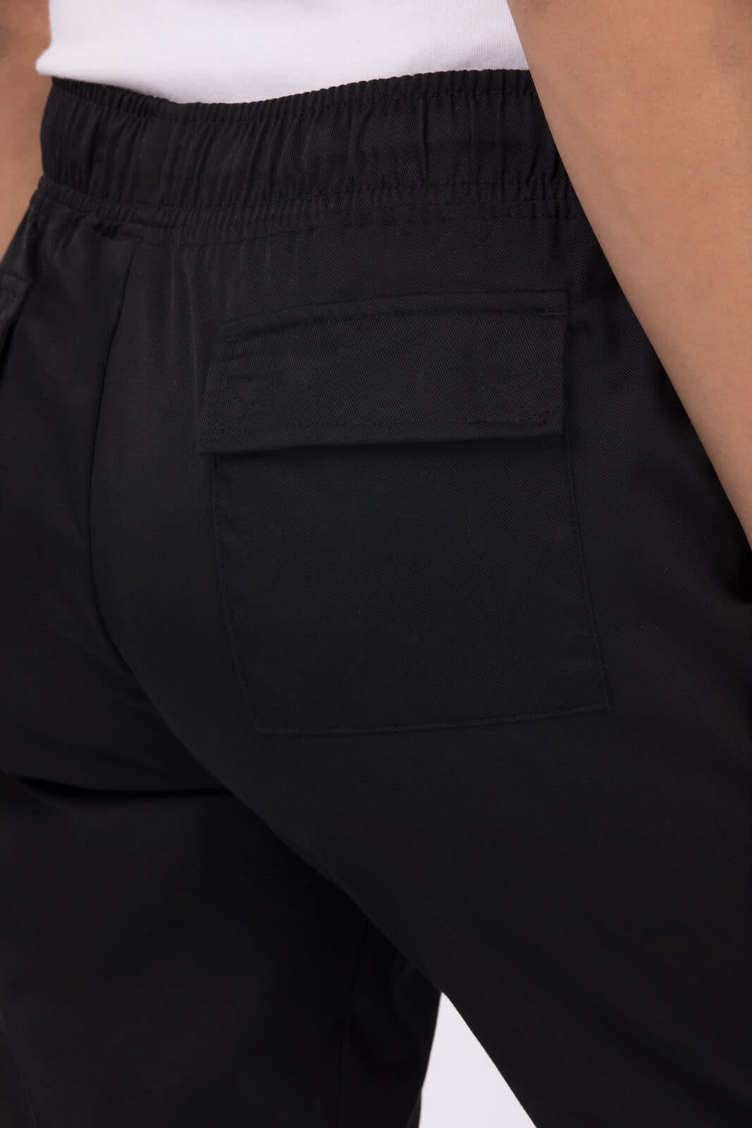 Black women's chef pants featuring an elastic waistband and a back pocket. The garment has a smooth finish.