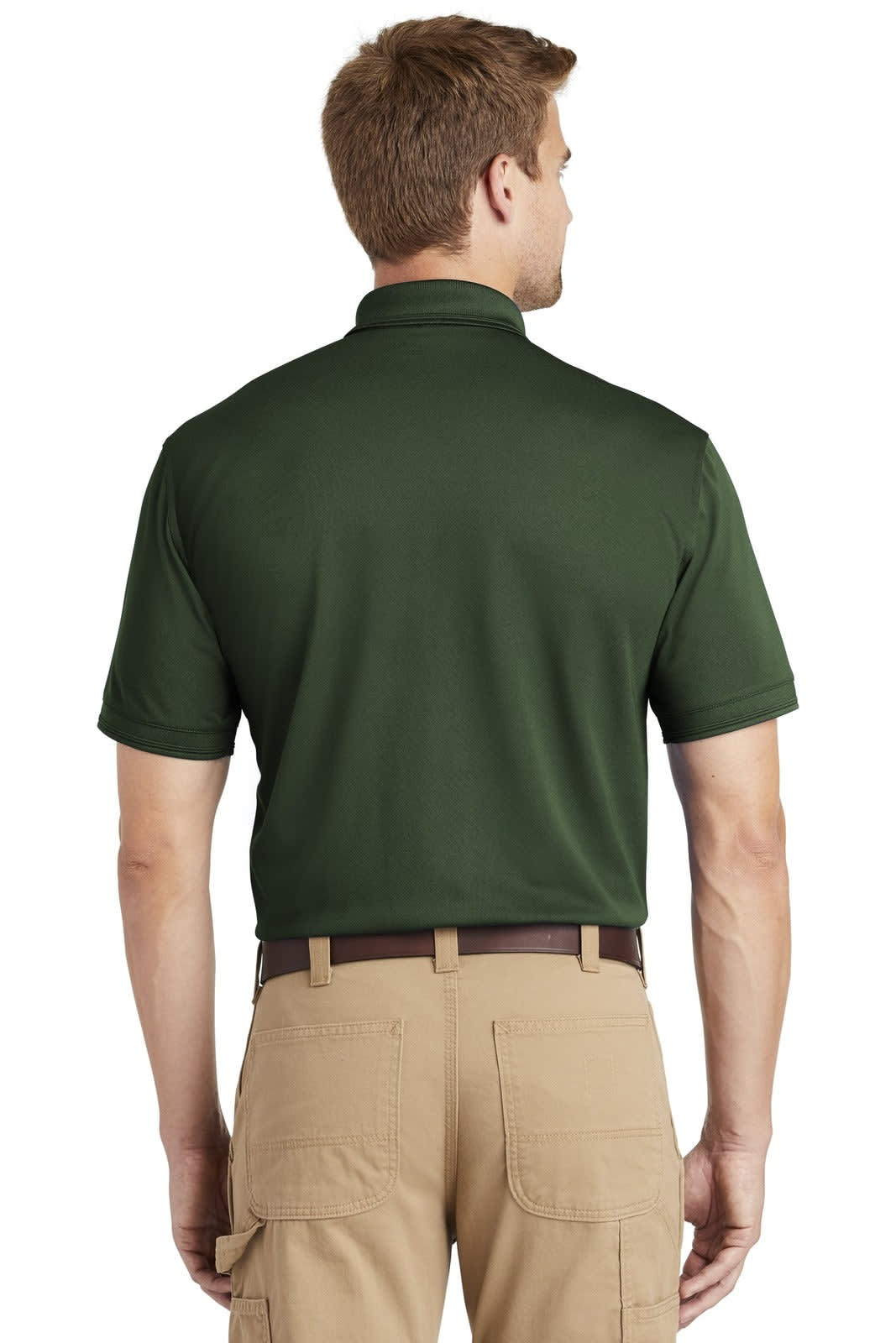 A man in a dark green polo shirt stands with his back to the viewer, wearing beige pants. The polo features a logo.