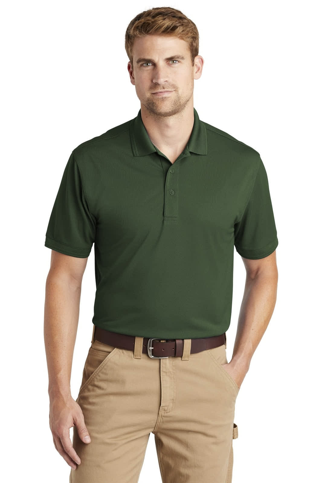 A man models a green polo shirt with a collar, paired with beige trousers. The shirt features a branding logo.