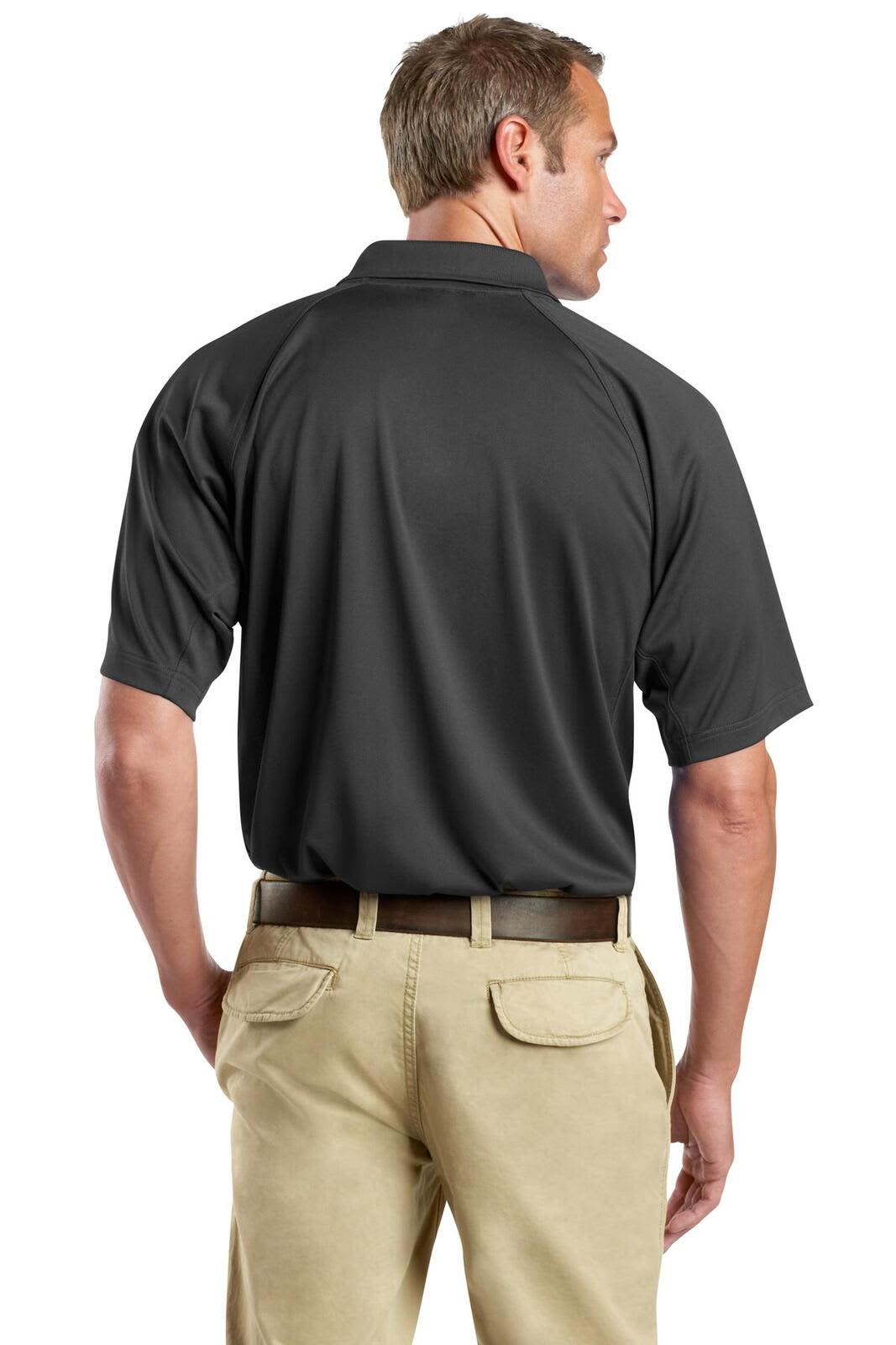 A man wearing a dark grey polo shirt, viewed from the back, with beige trousers. The shirt has a logo.