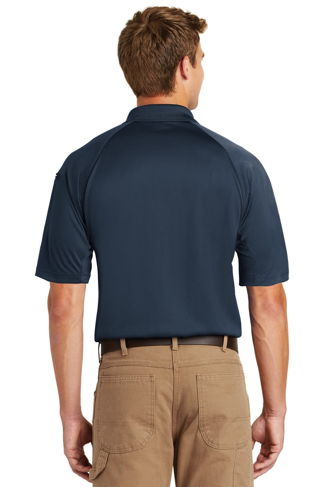 A navy polo shirt displayed from the back, featuring a logo and short sleeves. Worn with beige trousers.