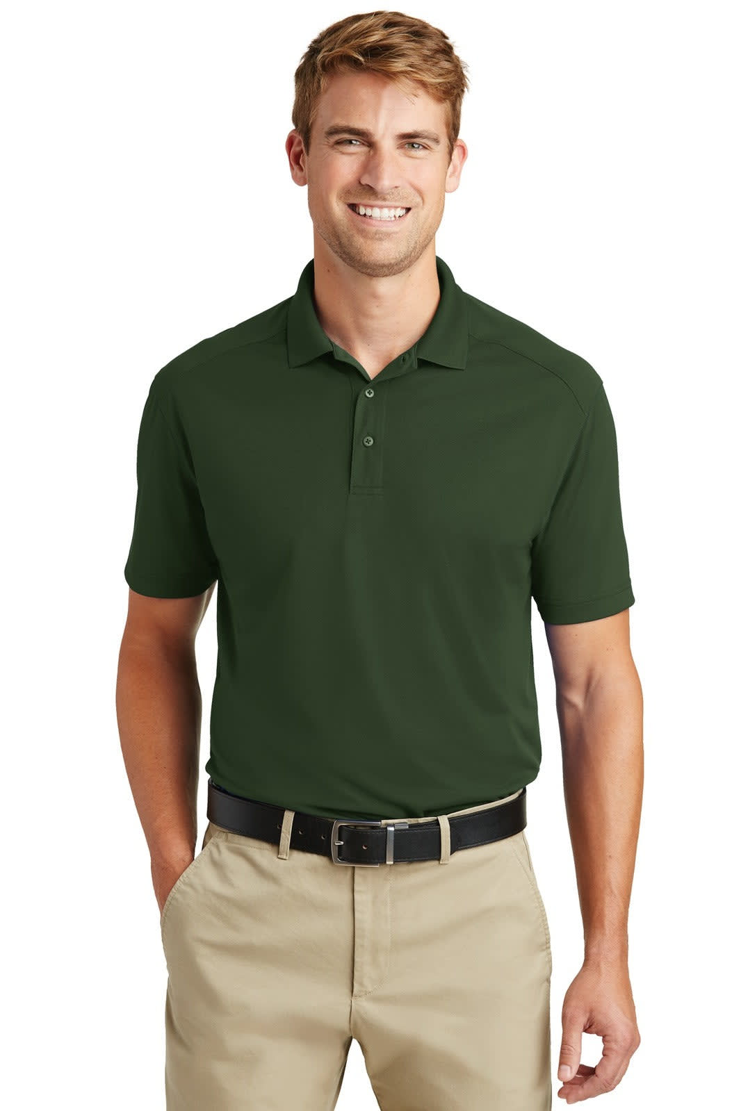 A man wearing a dark green lightweight snag-proof polo shirt and beige trousers, with a belt, smiling.