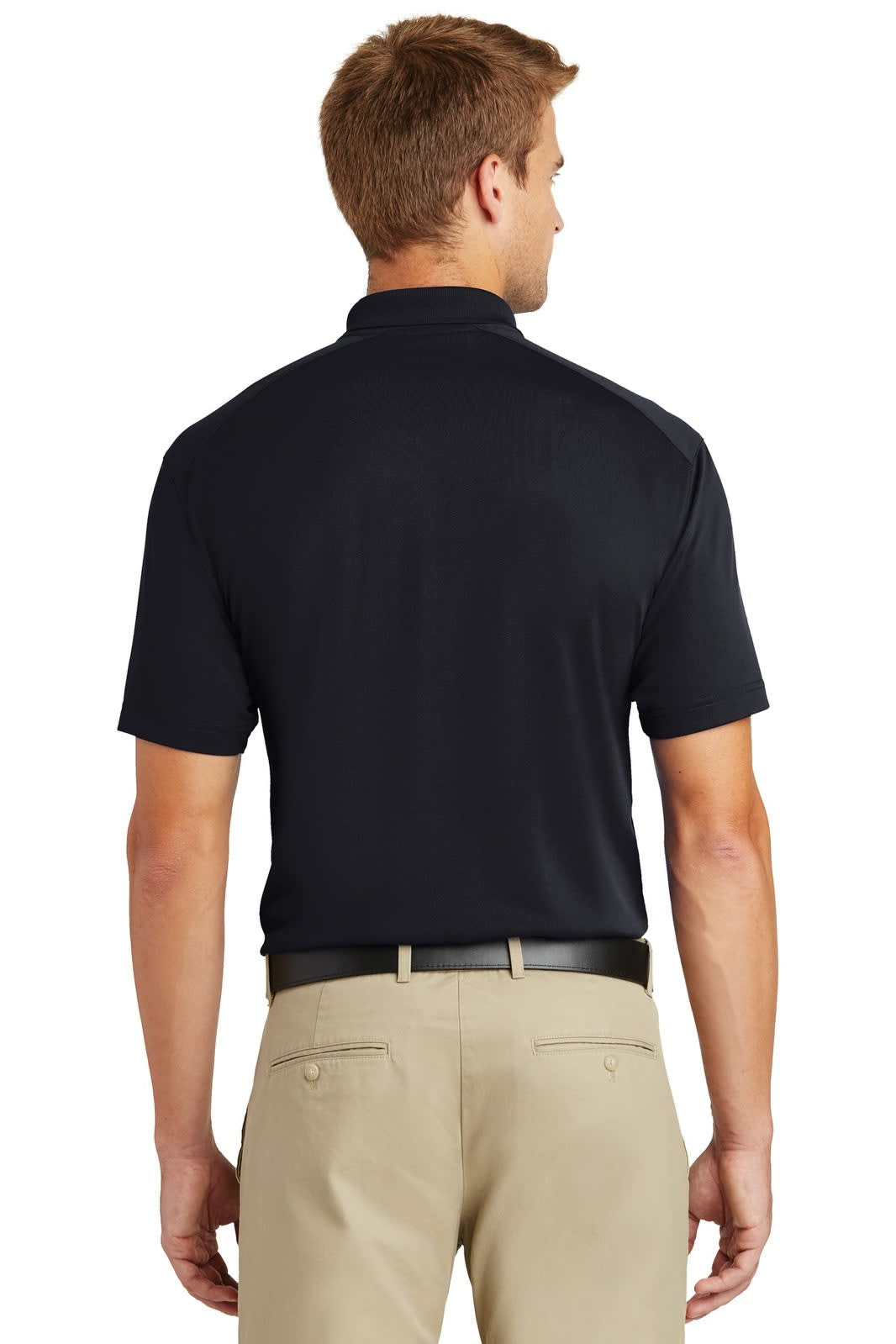A man wearing a black polo shirt viewed from the back, paired with light-coloured trousers. The shirt has a logo.