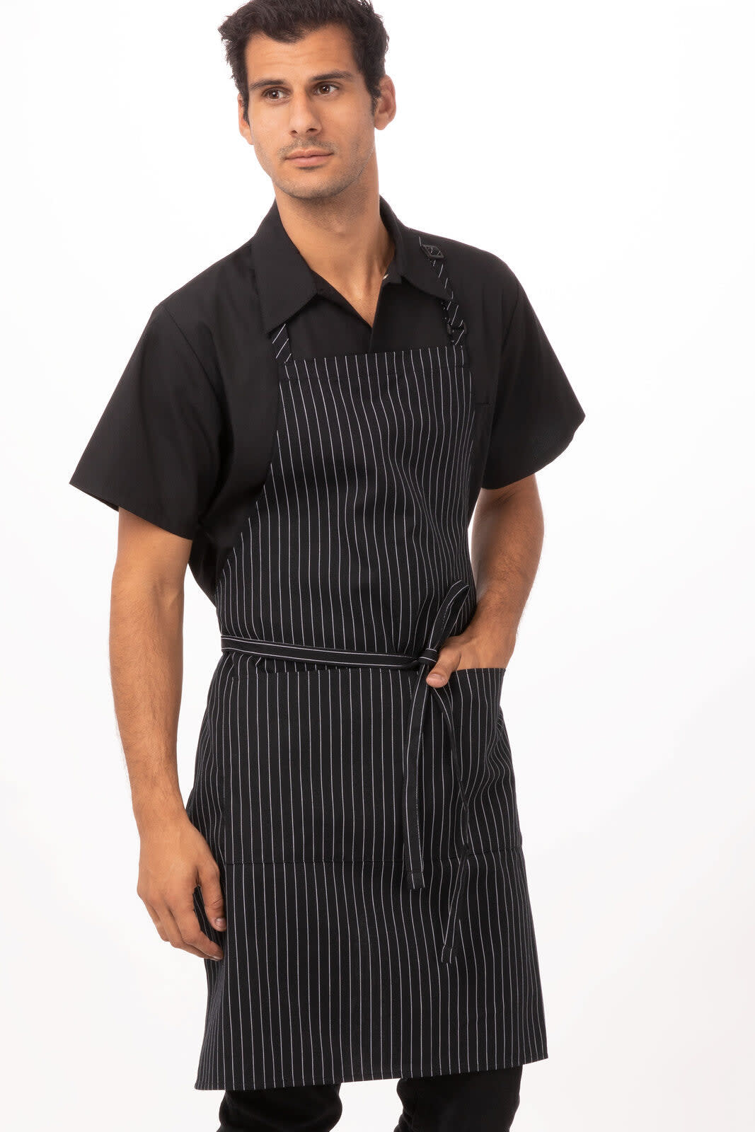 A striped black adjustable bib apron worn by a model, featuring a front pocket and matching ties.