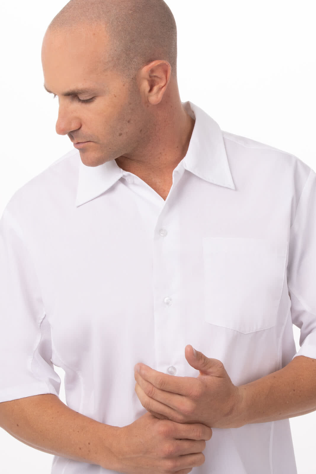 A white short-sleeved men's cook shirt with a chest pocket and a logo.