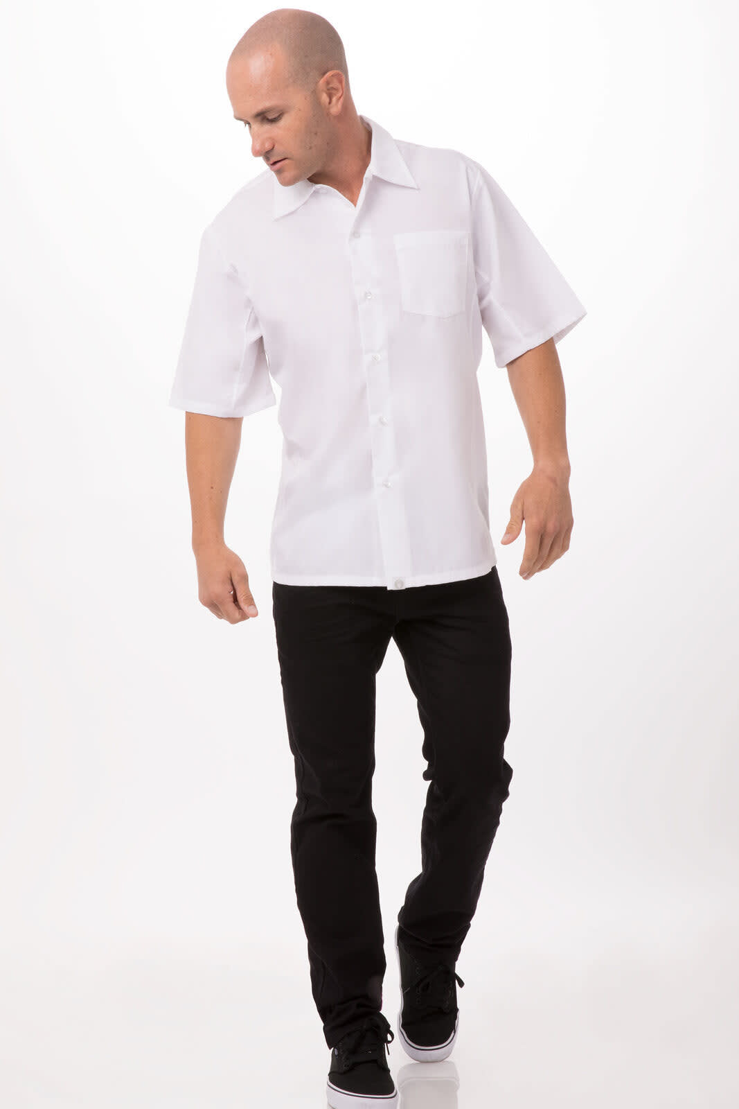 A short-sleeved white cook shirt with a button-up front and a chest pocket, worn with black pants.