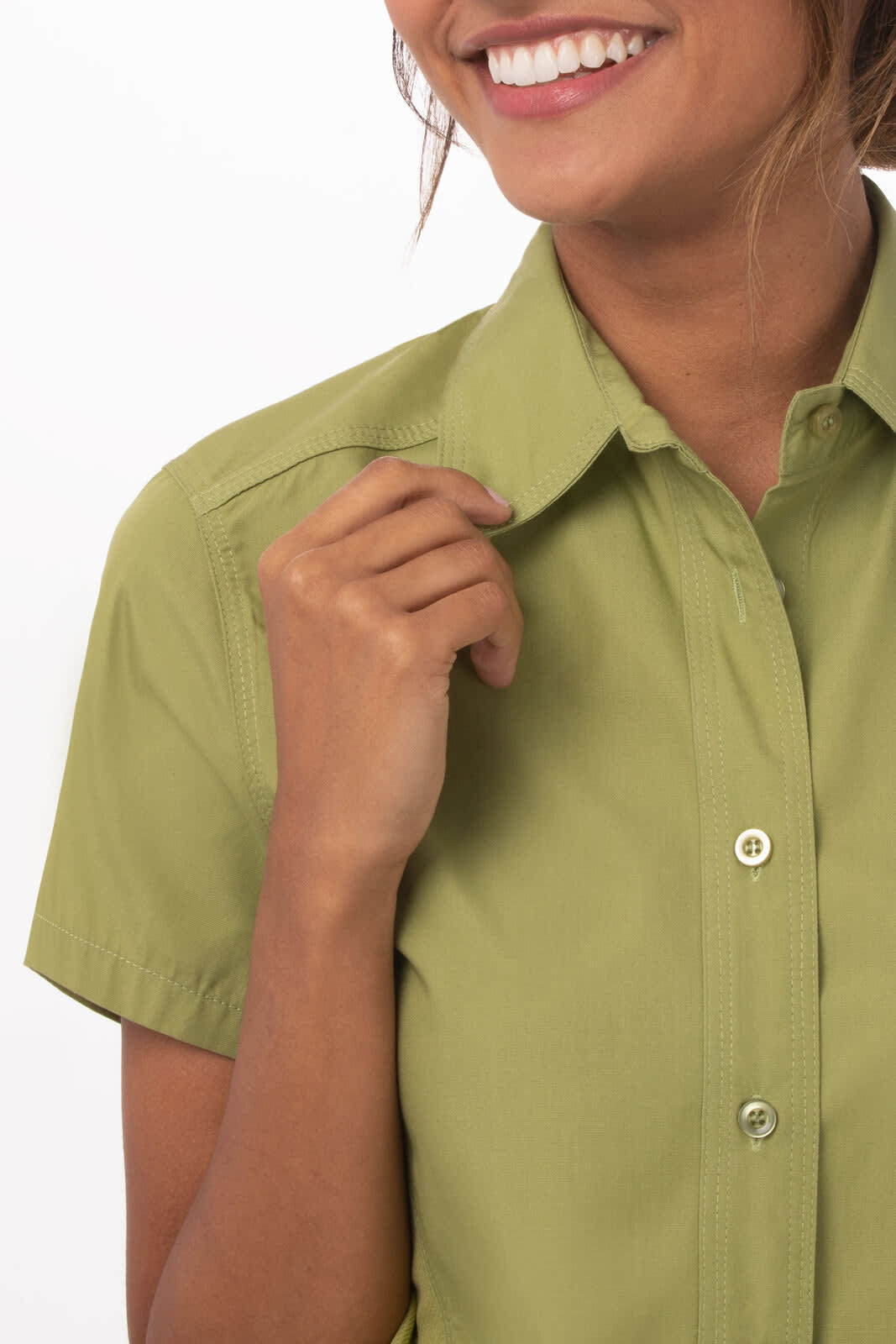 A short-sleeved, pale green women's shirt with a collar and buttons, featuring a standard fit.