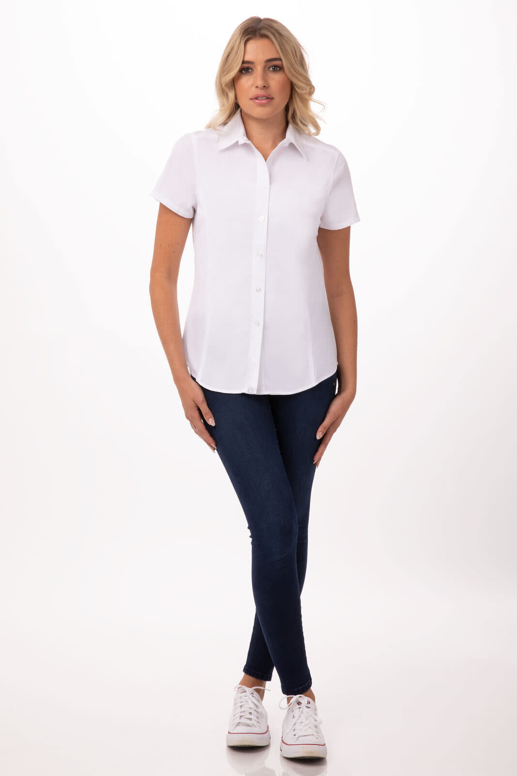A white short-sleeve shirt displayed on a model paired with dark blue jeans and white shoes. Includes a logo.