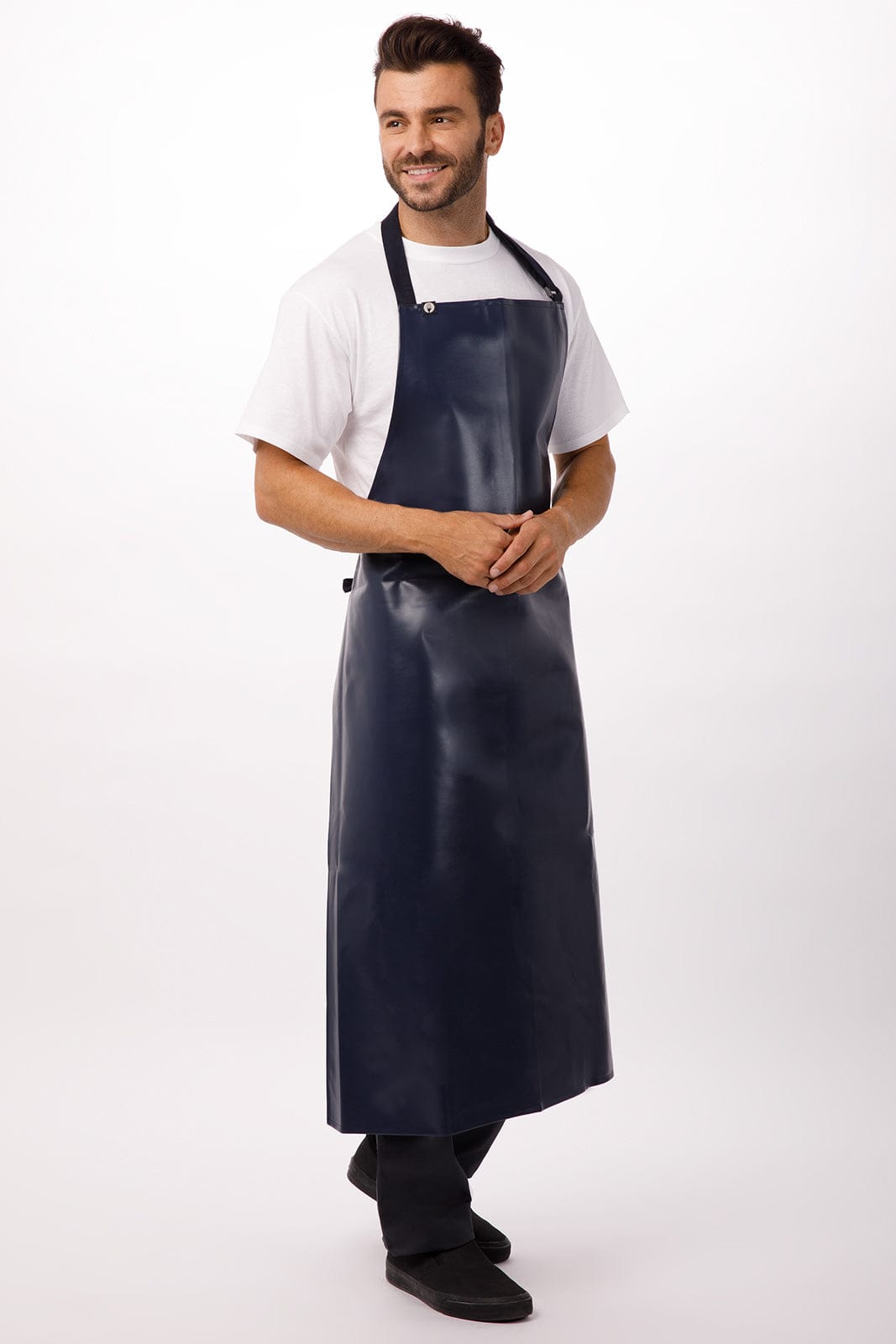 A navy blue PVC bib apron worn by a smiling man, featuring adjustable straps and a logo.