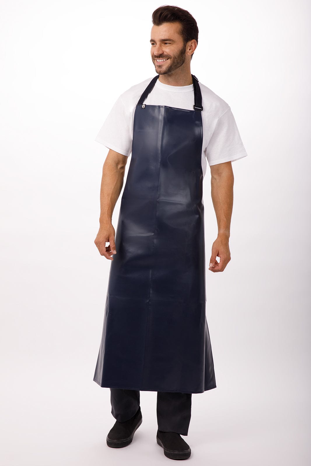 A navy blue PVC bib apron worn by a smiling man, featuring adjustable straps and a sleek design.