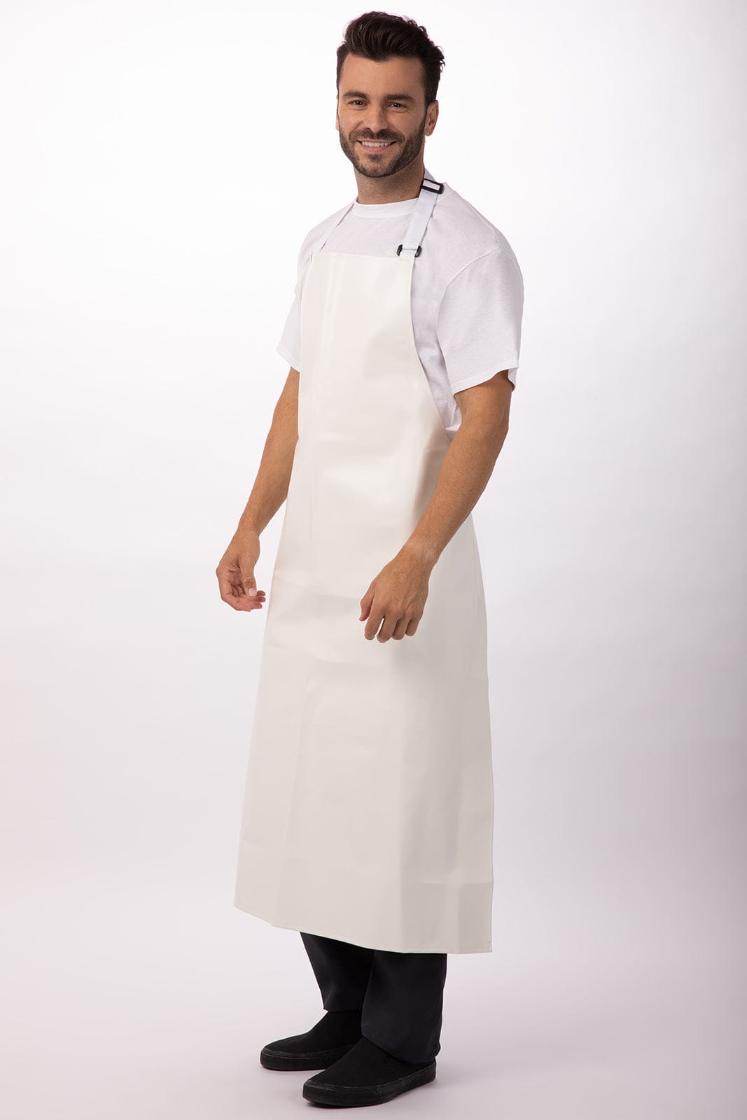 A white PVC bib apron is worn by a smiling man, featuring a simple design and an attached logo.