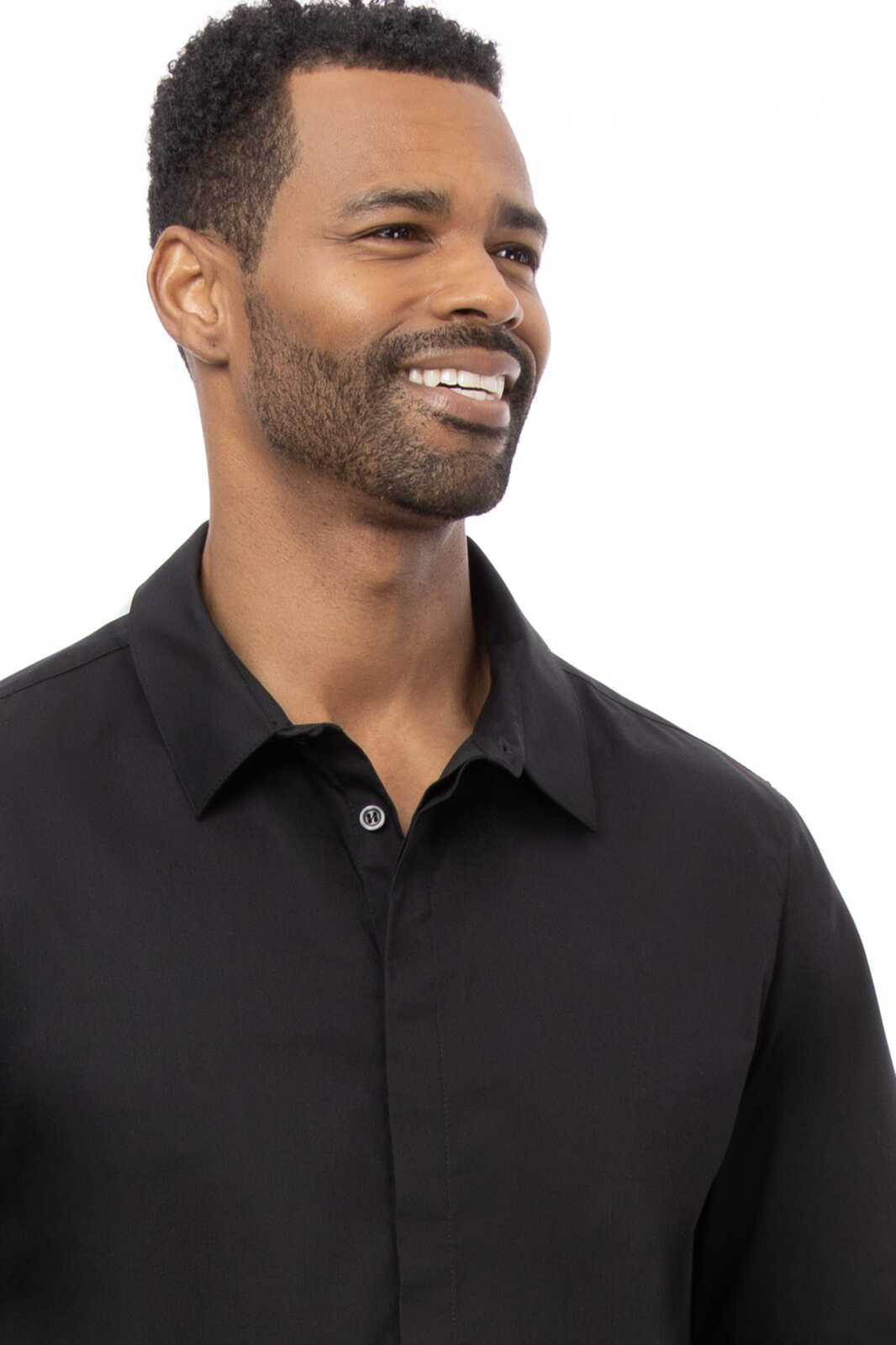 A black premium formal men's dress shirt with a button-up front and a collar, worn by a smiling man.
