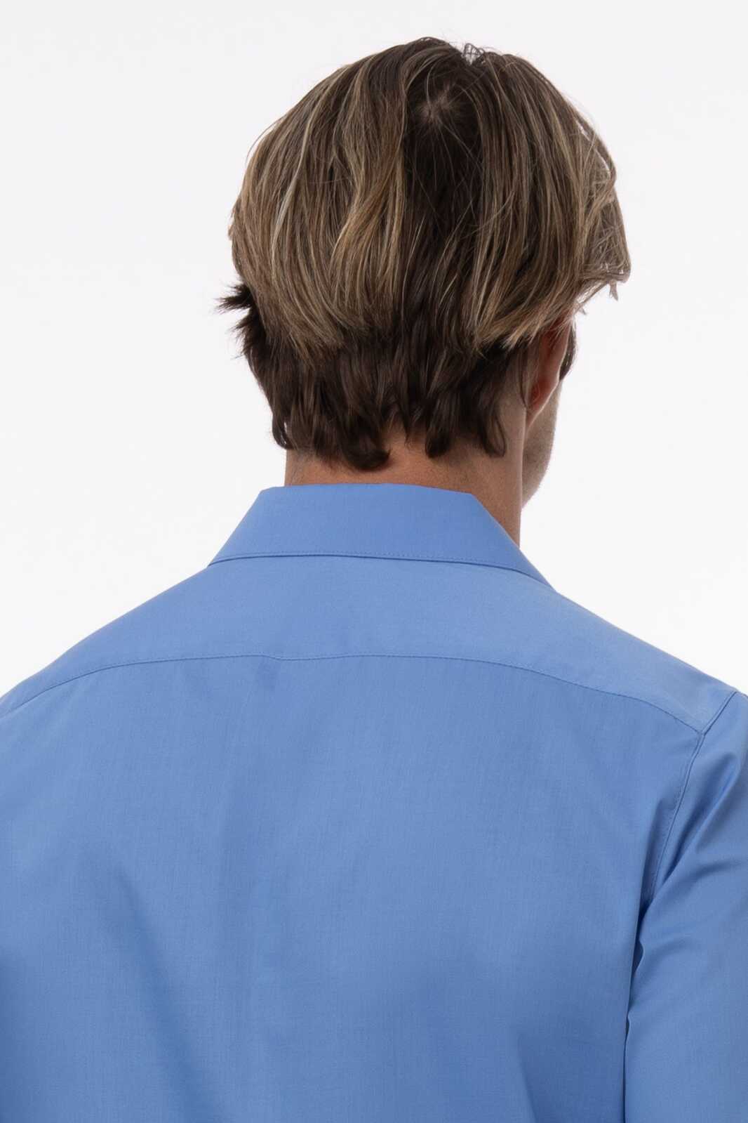 A premium formal men's dress shirt in light blue, featuring a classic collar and minimal design.