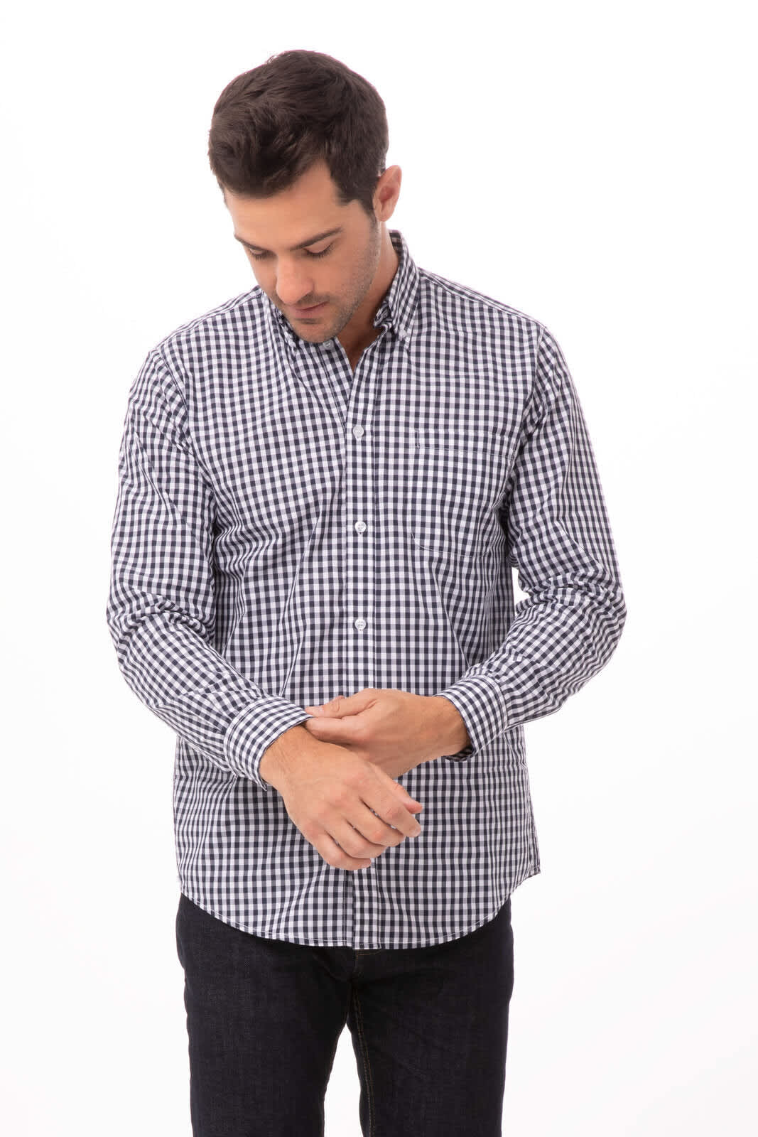 A men's button-up dress shirt featuring a black and white checked pattern, with long sleeves and a collar.