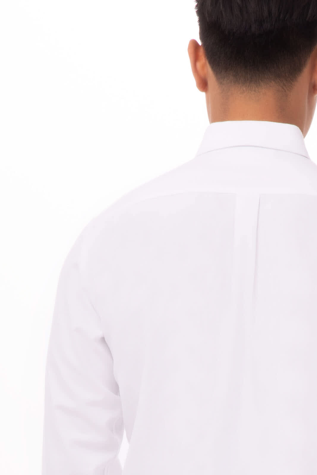 A white Oxford men's dress shirt featuring a button-up design and back pleat detail. The shirt has a logo.