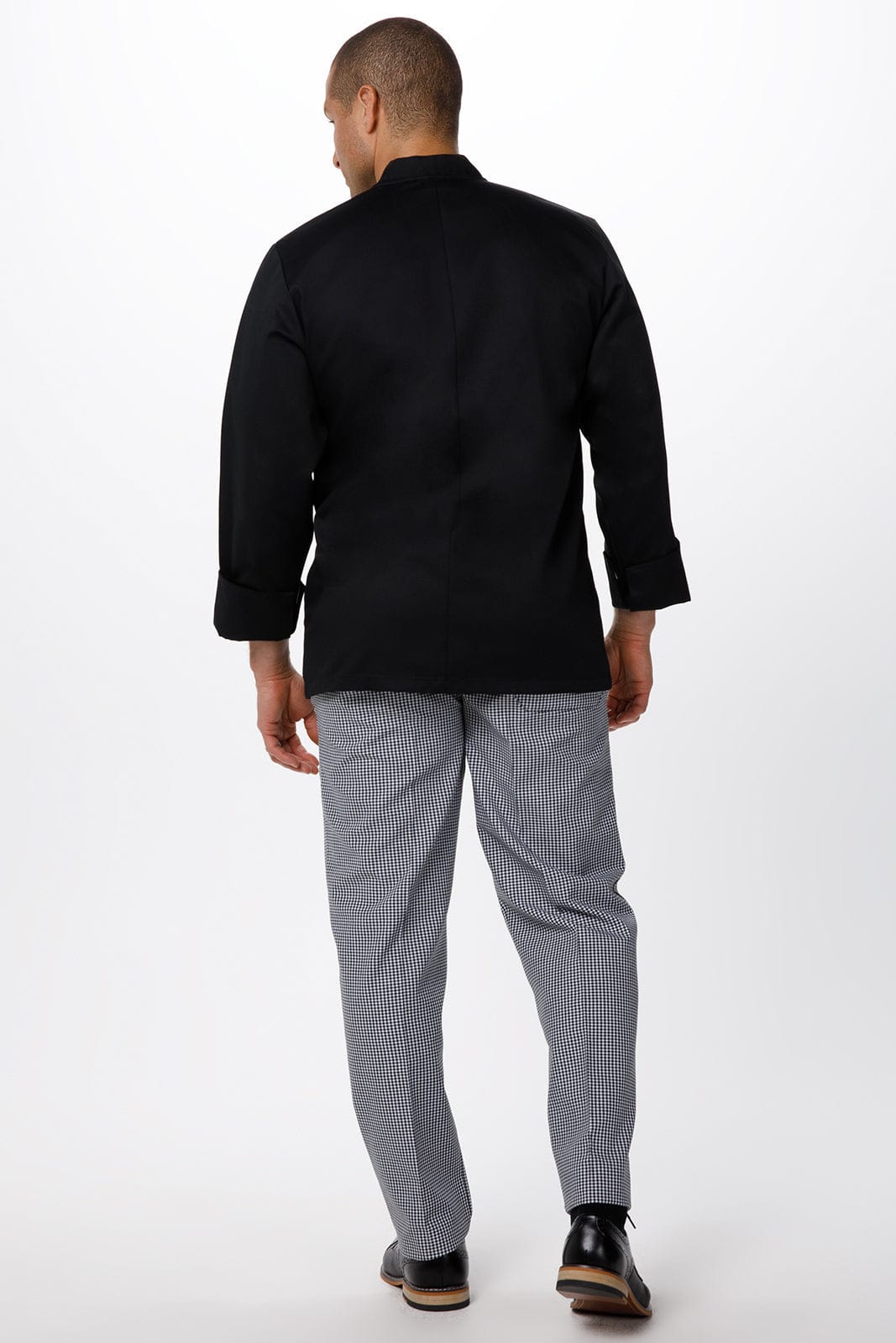 A black men's chef jacket is worn with grey striped chef pants, viewed from the back. The jacket has a simple design.
