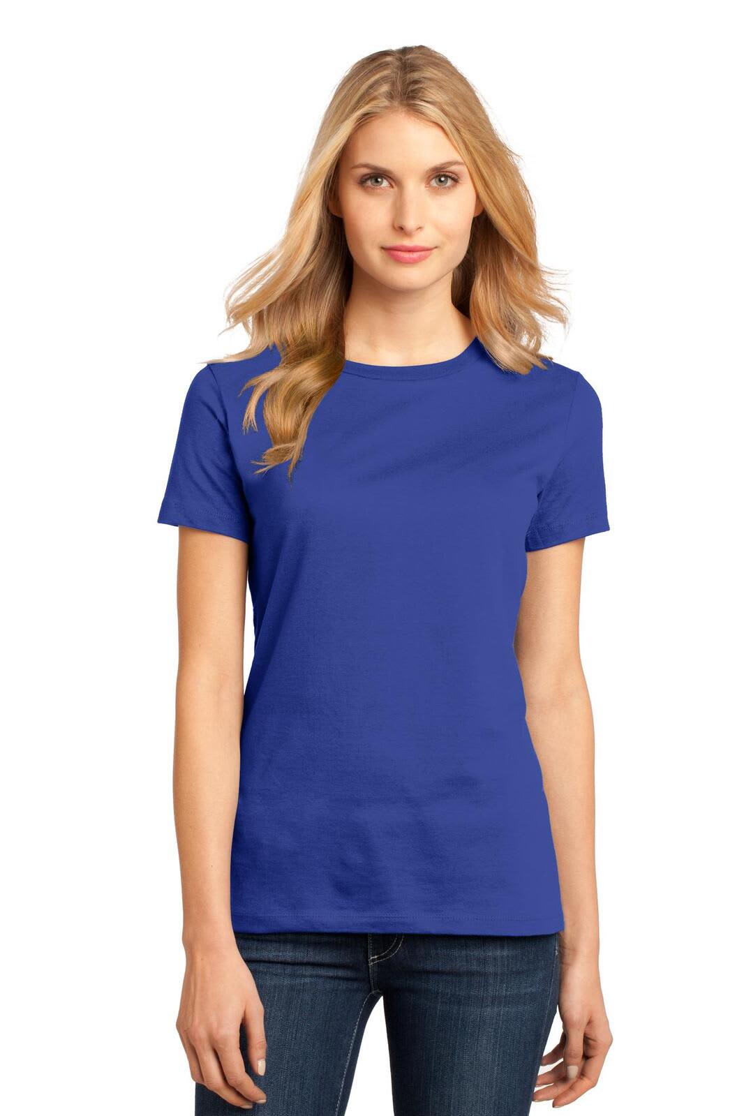 A woman in a blue crew tee shirt stands smiling, featuring a logo on the shirt. The fit is casual and simple.