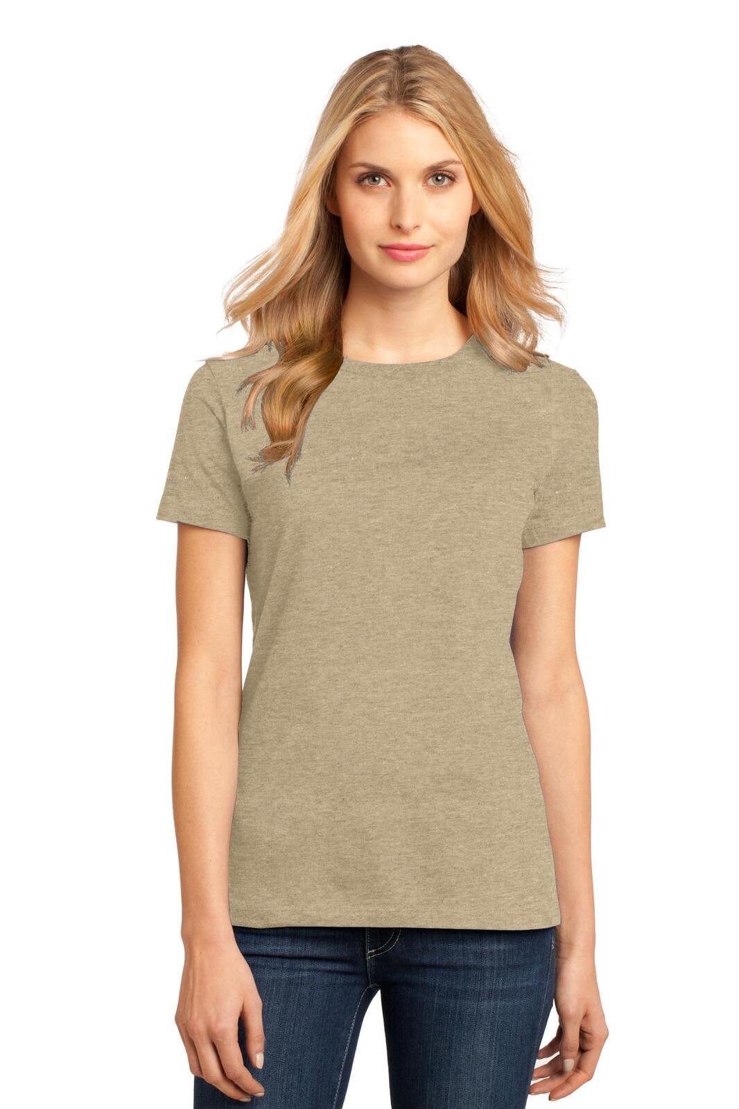 A model wearing a ladies' crew tee in a light brown hue, paired with dark jeans. The shirt features a logo.