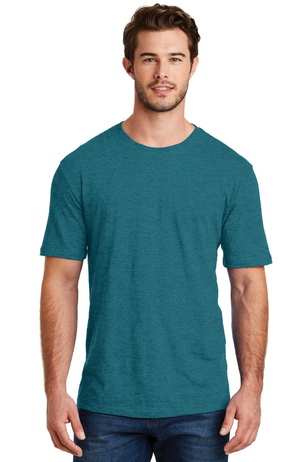 A man in a teal crew neck t-shirt stands against a plain background, featuring short sleeves and a casual style.
