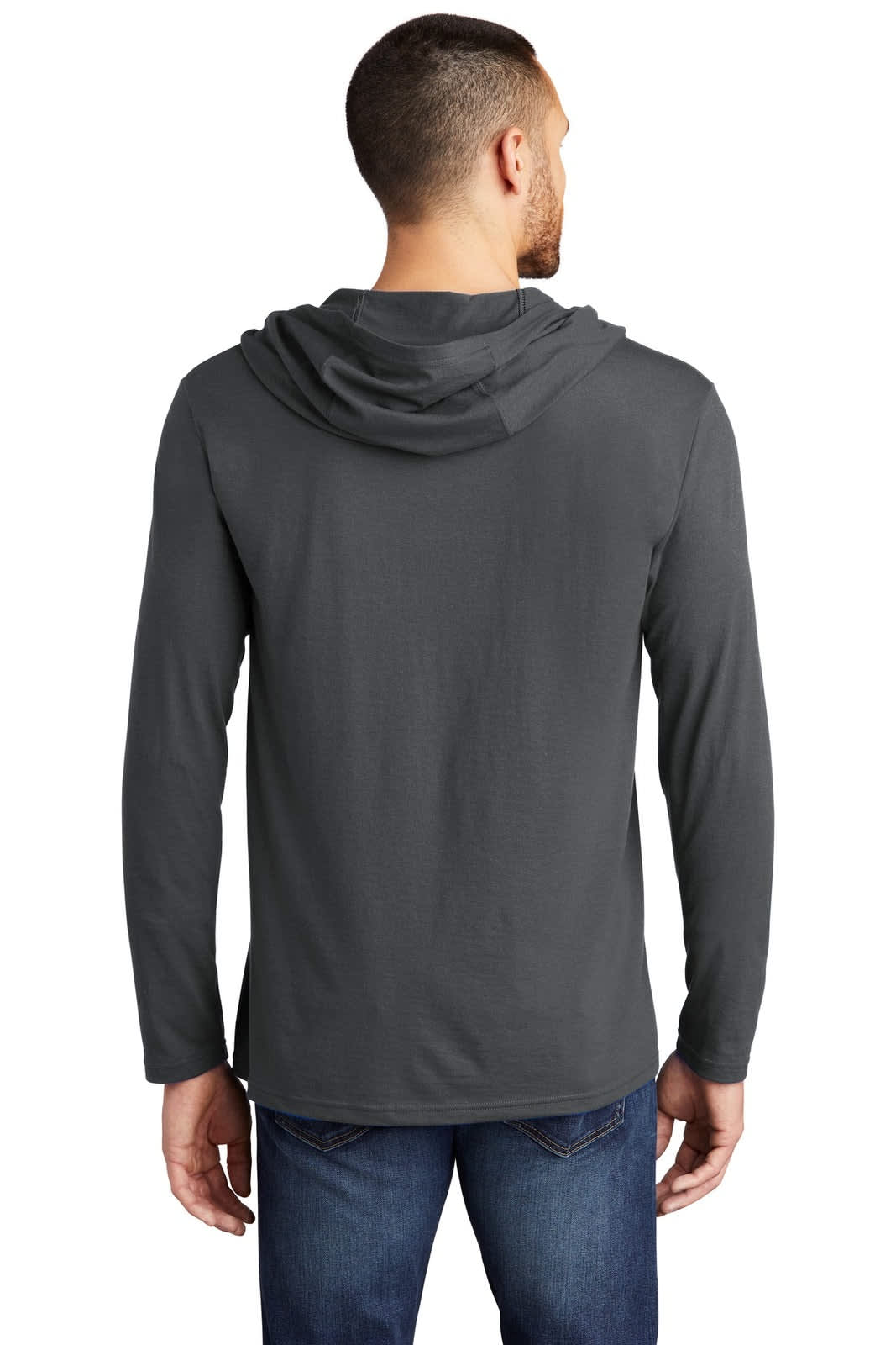 A man wearing a dark grey long sleeve hoodie with a hood, viewed from the back. The hoodie features branding.