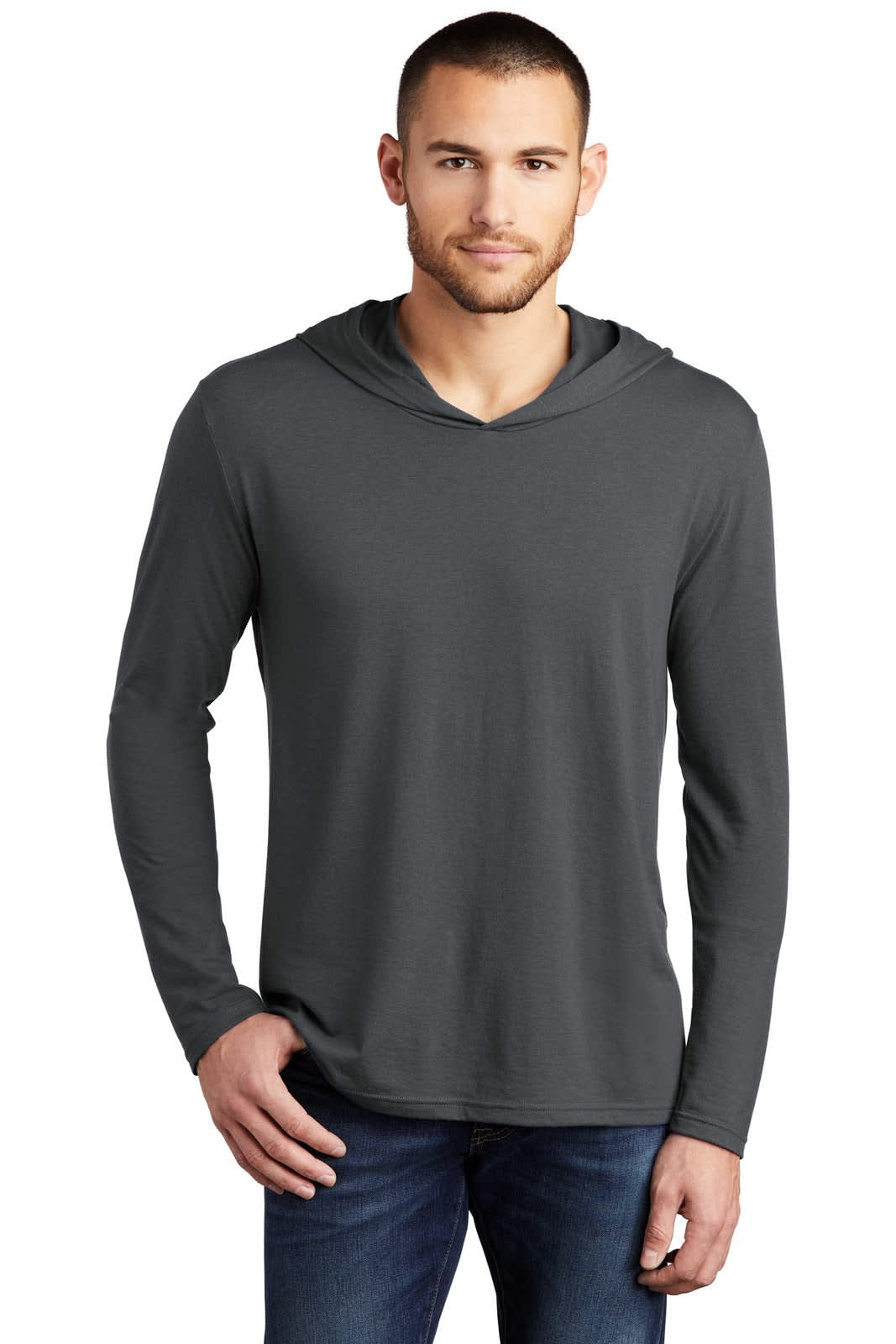 A man wearing a dark grey long sleeve hoodie with a hood, featuring a logo.