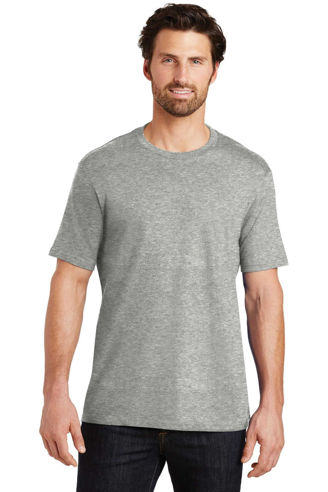 A man is wearing a grey crew neck t-shirt. The shirt has a logo on it and features short sleeves.