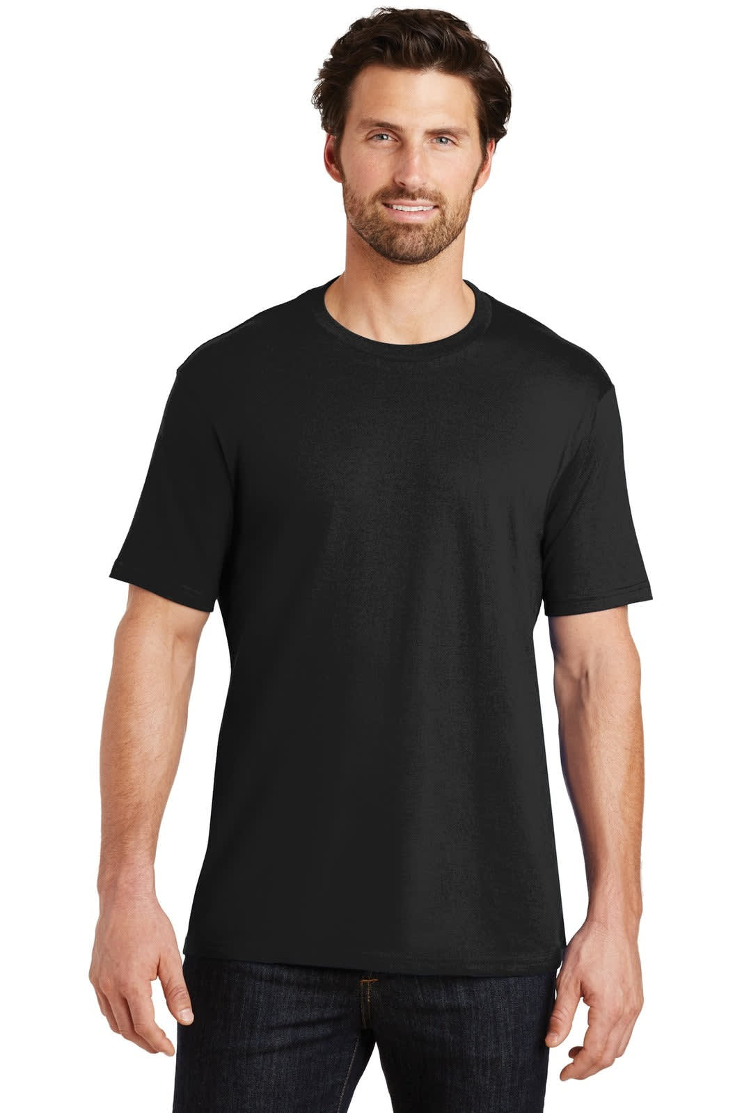 A man wearing a black crew neck t-shirt stands confidently, showcasing a classic design with short sleeves.
