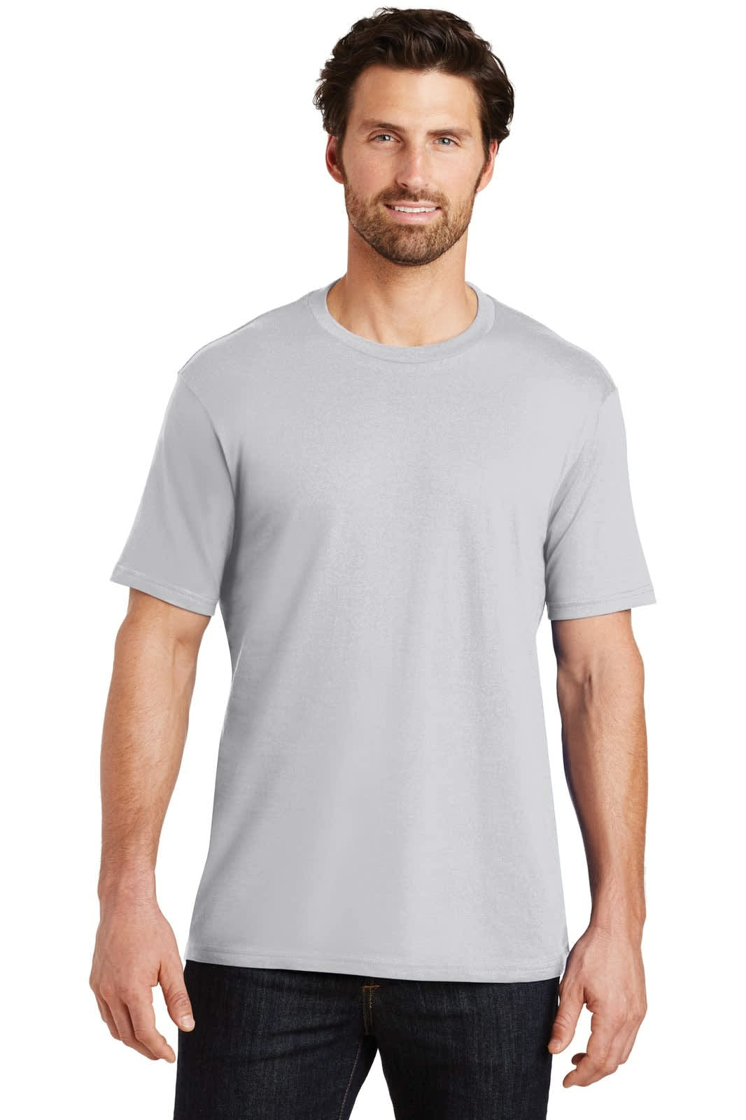 A man wearing a light grey crew t-shirt, standing casually with a neutral expression. The shirt features short sleeves.