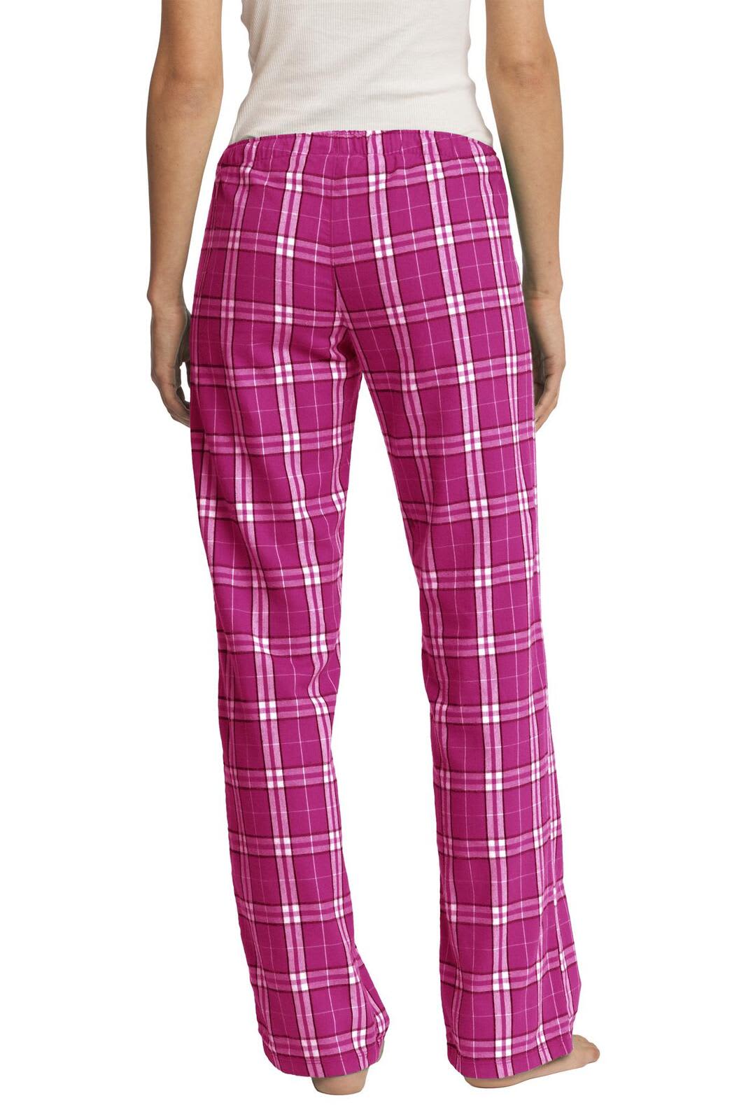 A pair of women's flannel pants in vibrant pink with a plaid pattern, featuring a relaxed fit and wide legs.