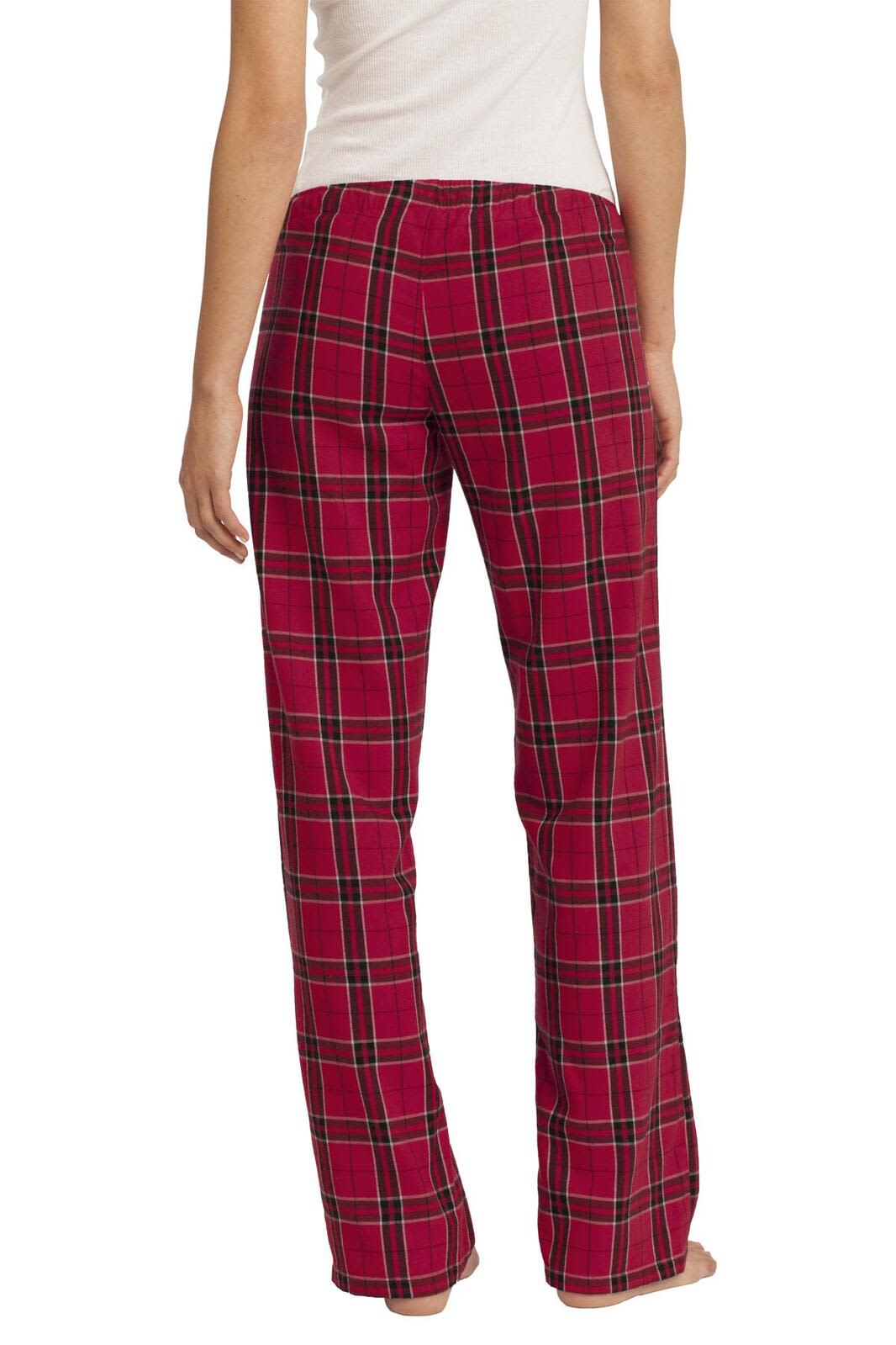 A pair of red flannel plaid pants with a relaxed fit, featuring a back view and a checkered pattern.