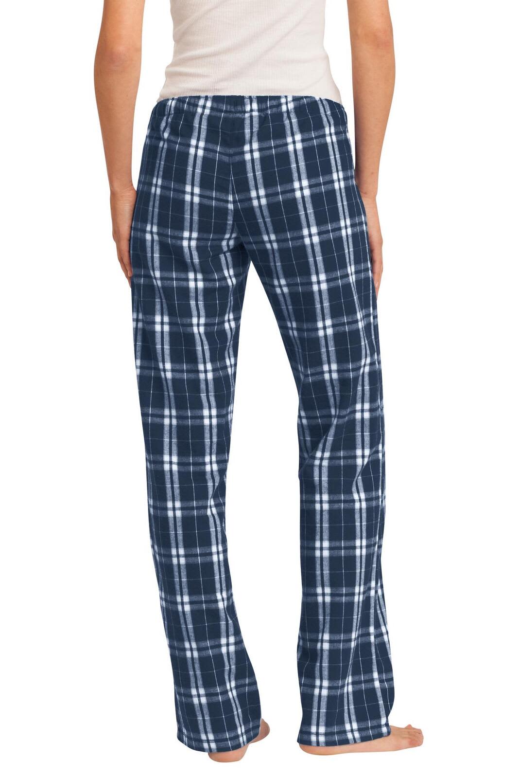 Navy blue and white plaid flannel pants with a relaxed fit, featuring a logo on the waistband.