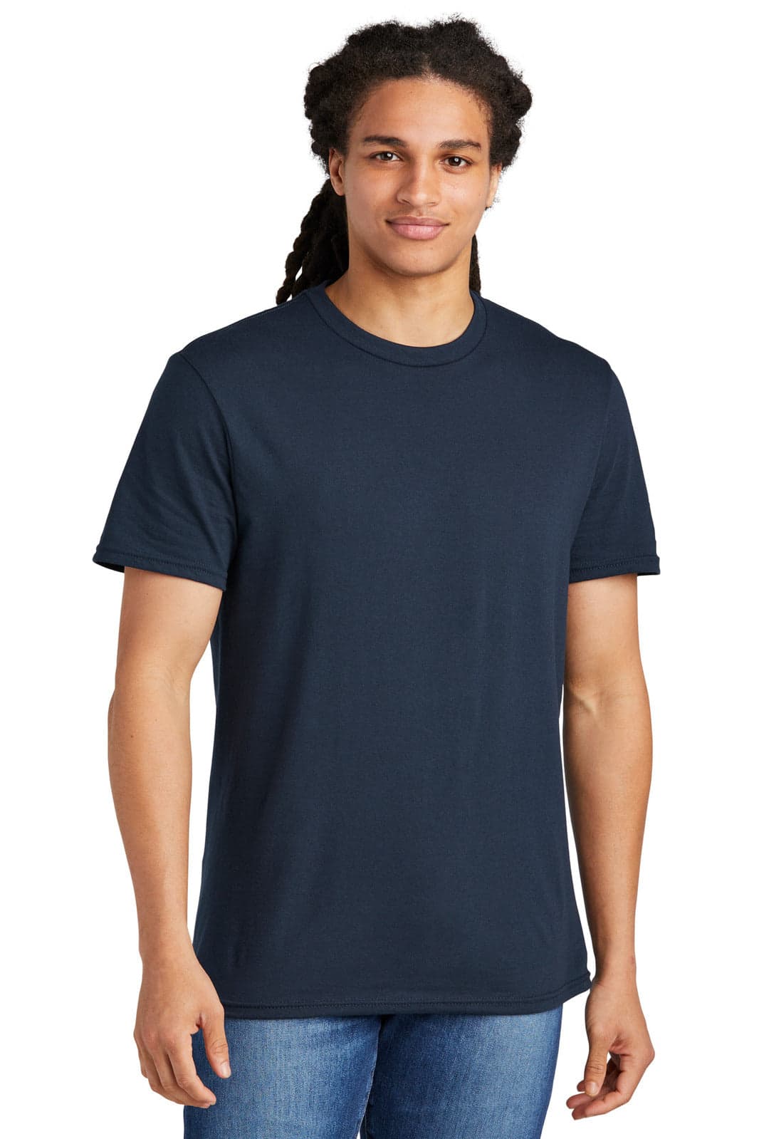 A young man wearing a plain navy blue t-shirt. The shirt features a round neck and short sleeves.