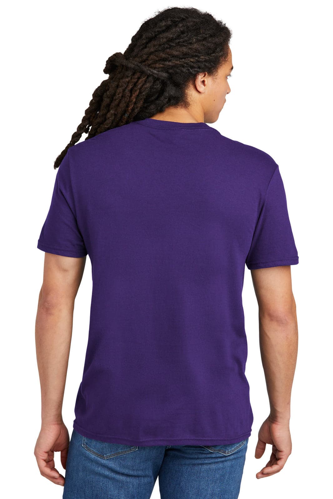 A young man with dreadlocks wearing a plain purple t-shirt, viewed from the back. The shirt has a logo.