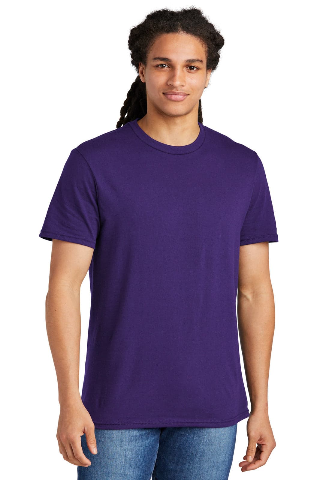 A young man wearing a plain purple t-shirt, with short sleeves and a relaxed fit. The t-shirt has a logo on it.