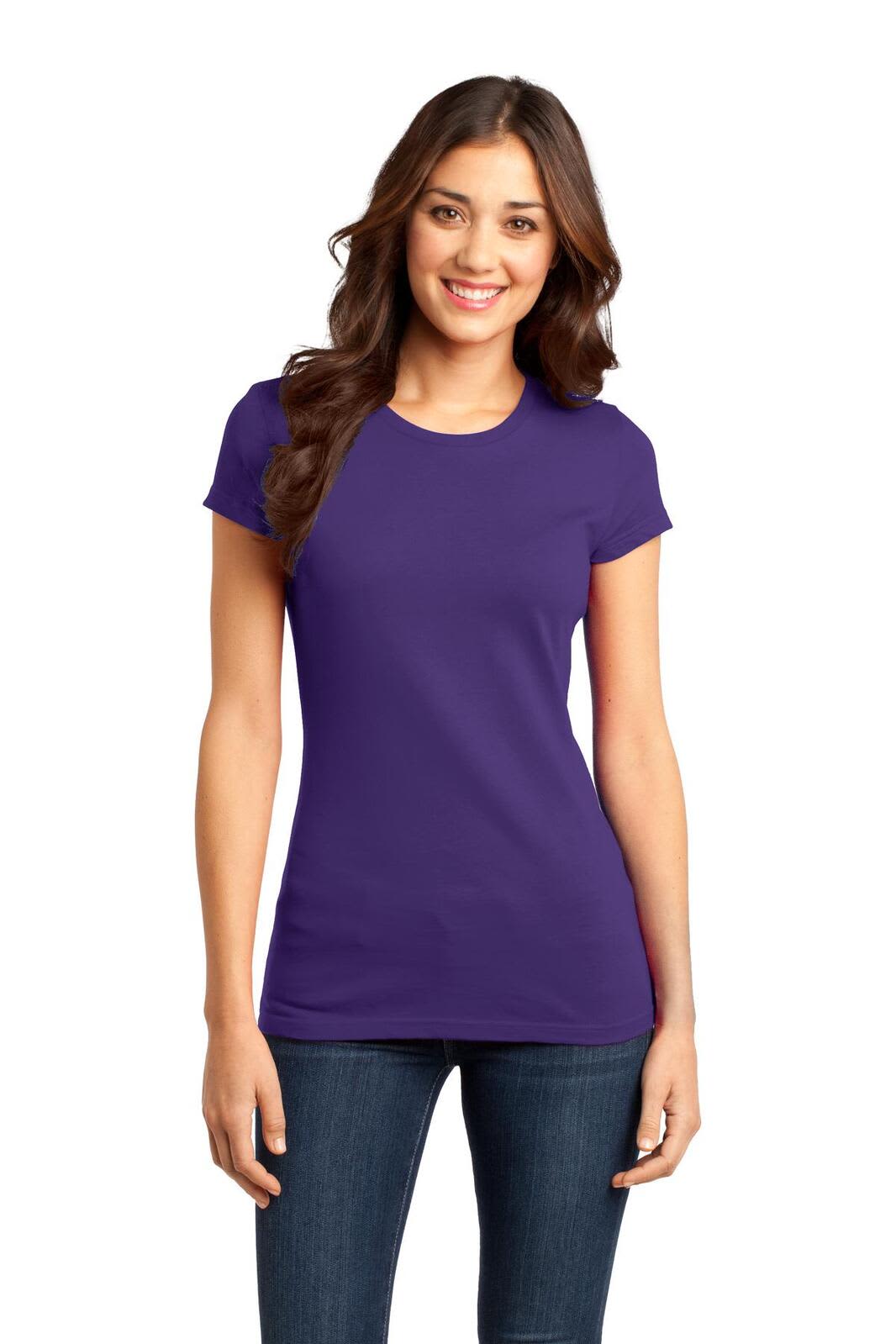 A young woman is wearing a fitted purple t-shirt, standing confidently with her hands on her hips.