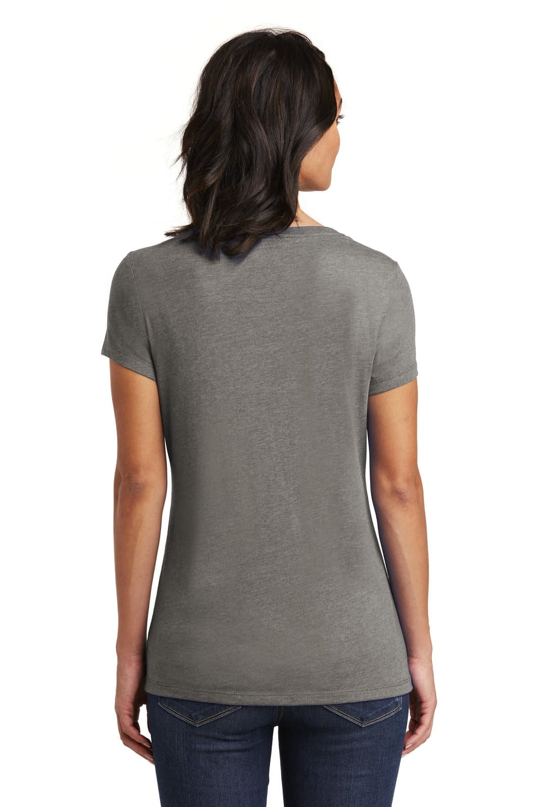 A woman in a grey v-neck t-shirt faces away, showcasing the back design of the shirt. There is a logo on the shirt.