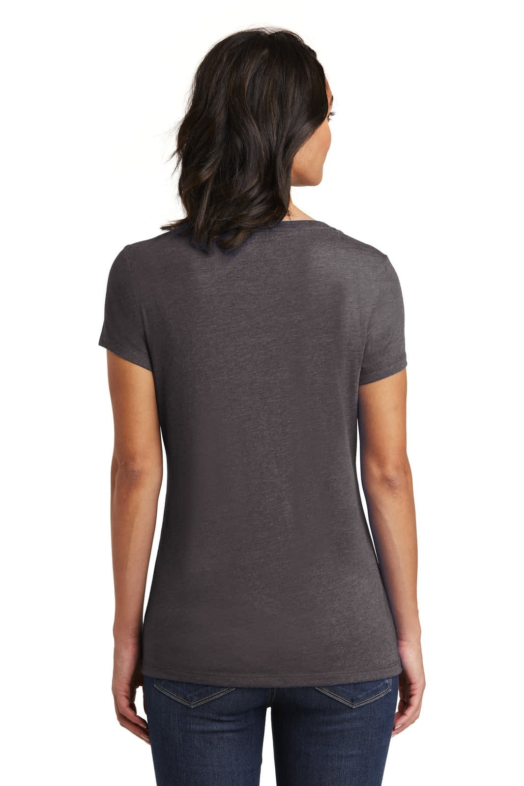 A woman is wearing a dark grey V-neck t-shirt, viewed from the back, paired with jeans. The shirt features a logo.