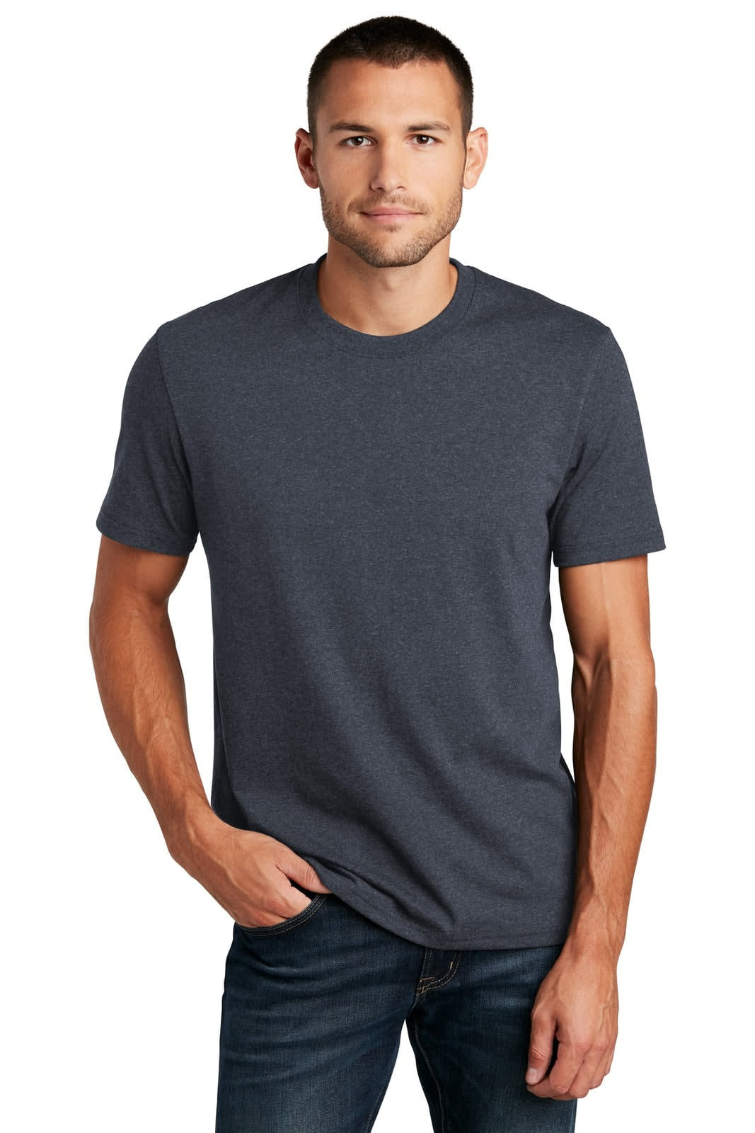 A man wearing a short-sleeved, charcoal grey t-shirt, standing with hands in pockets, displaying a branded design.