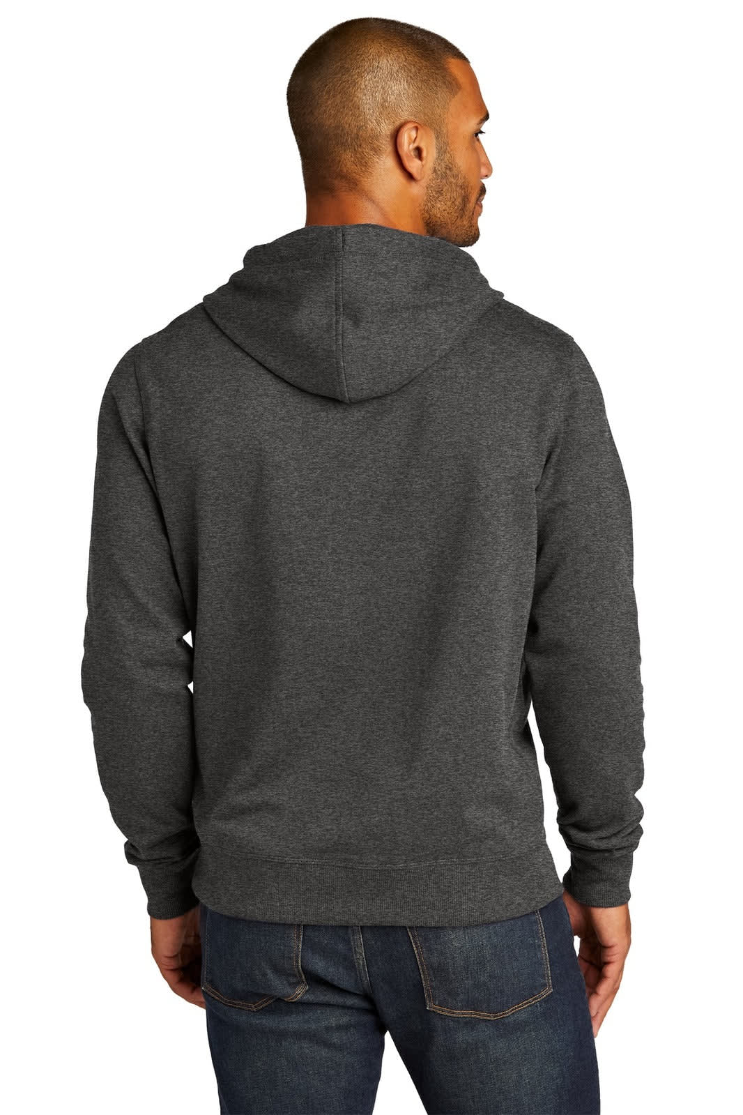 A man is wearing a charcoal grey District Re-Fleece Hoodie, viewed from the back. The hoodie has a logo.
