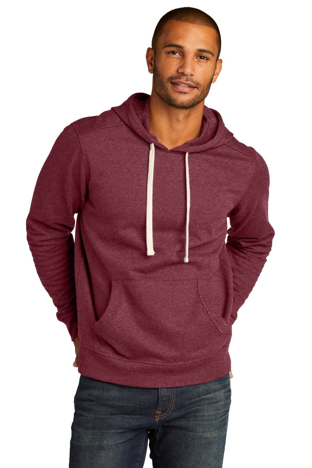 A maroon hoodie with a front pocket and drawstring hood, featuring a logo. Styled with jeans.