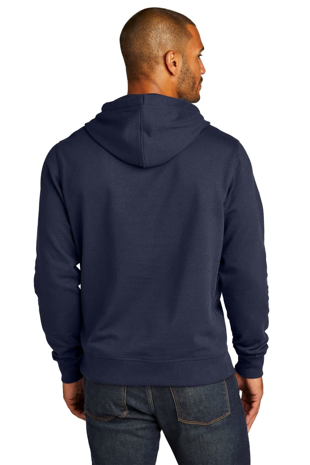 A man wearing a navy blue hoodie, with a hood, viewed from the back. The hoodie features a logo.