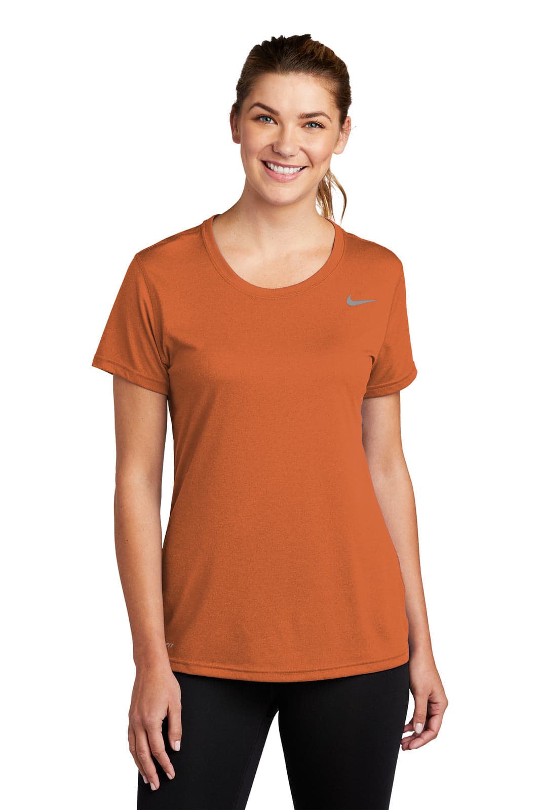 An orange Nike ladies' t-shirt with short sleeves and a round neckline, featuring a logo.