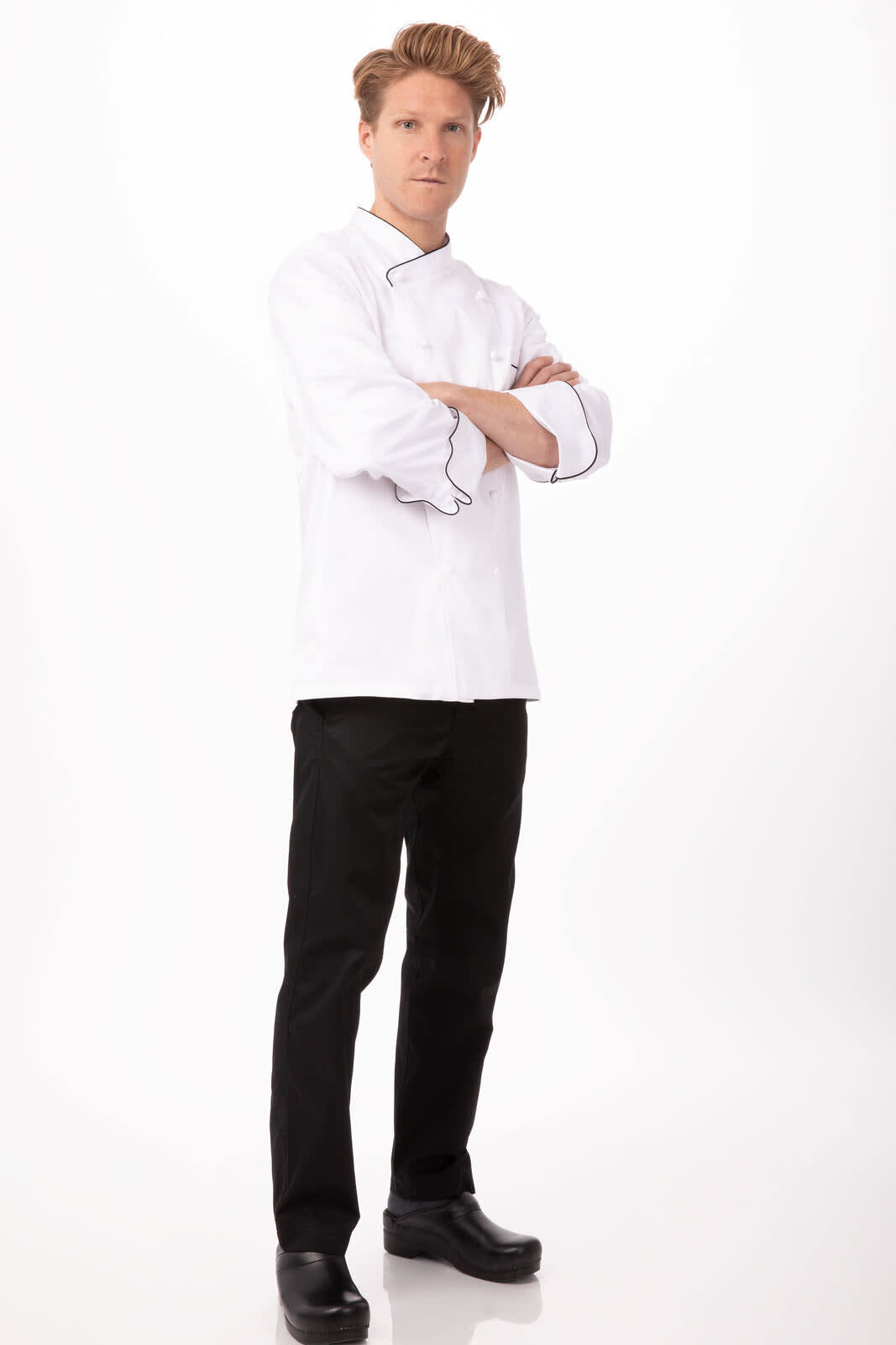 A male model wearing a white Monte Carlo men's premium cotton chef jacket, paired with black trousers and shoes.