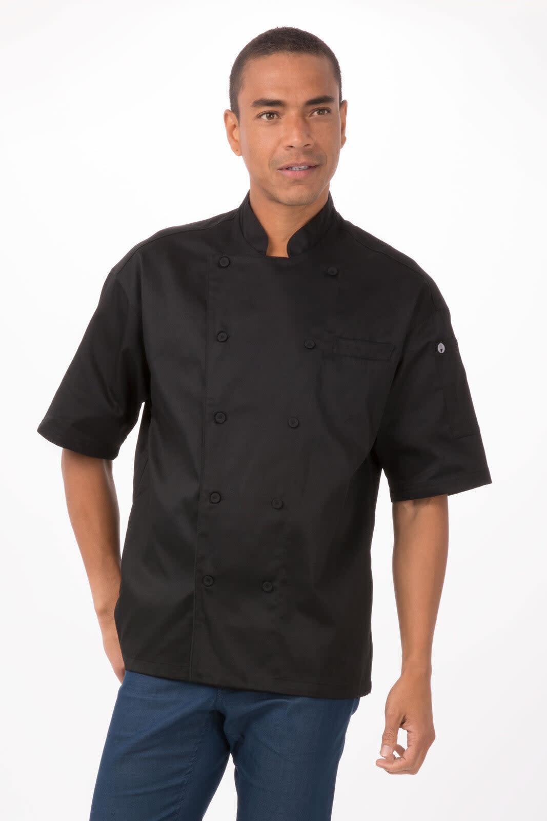 A chef jacket in black worn by a model, featuring short sleeves and a front button closure. The garment includes a logo.