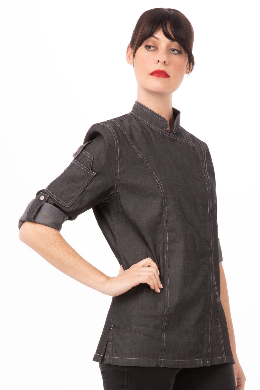 A black denim chef jacket for women, featuring a modern design and rolled sleeves. The jacket has a logo.