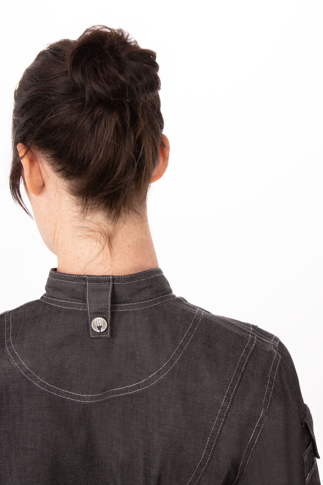 A black women's denim chef jacket featuring a buttoned collar and detailed stitching on the back.